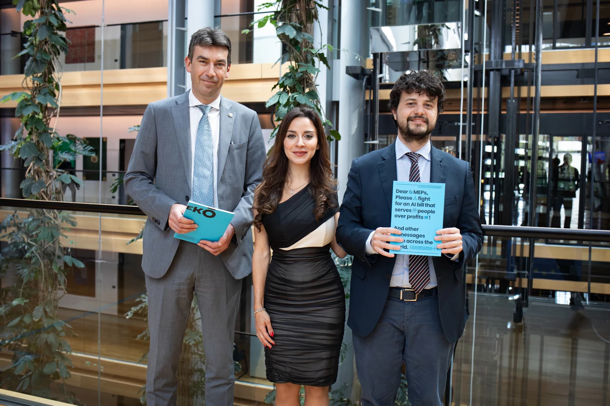AI Act co-rapporteurs Dragoș Tudorache and Brando Benifei holding campaign booklets at the European Parliament in Strasbourg