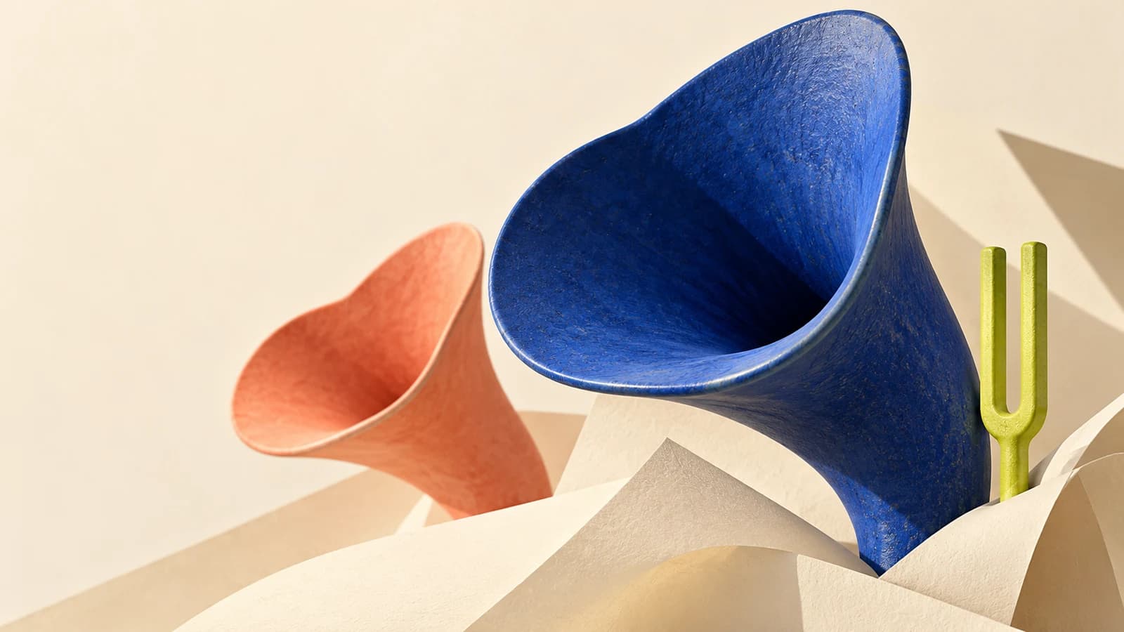 Conceptual artwork of a cobalt ceramic acoustic horn rising from folded cream paper, beside a lime tuning fork and a coral horn.